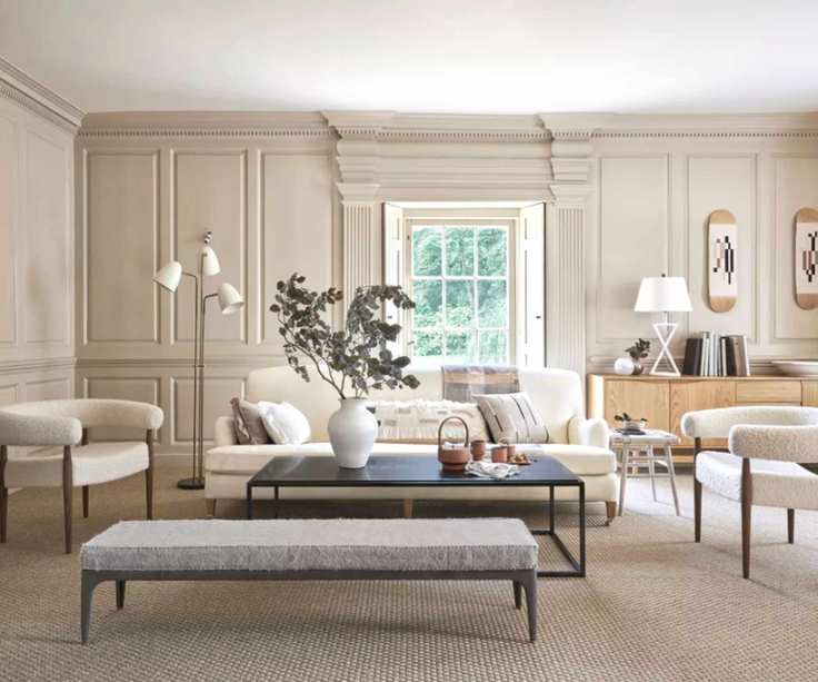 A neutral living room with large houseplant on coffee table