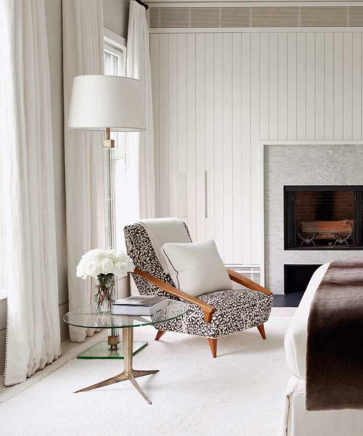 White bedroom corner with bespoke closet and white rug and curtains with lounger