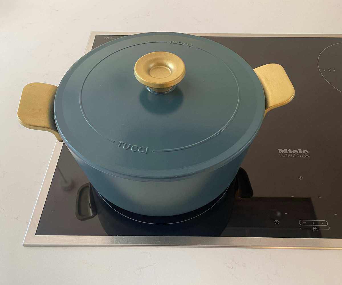 The Dutch Oven from Stanley Tucci's cookware collection on my induction hob