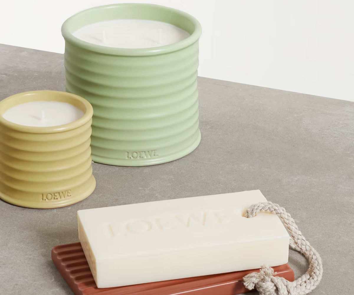 Loewe candles and a soap on a countertop