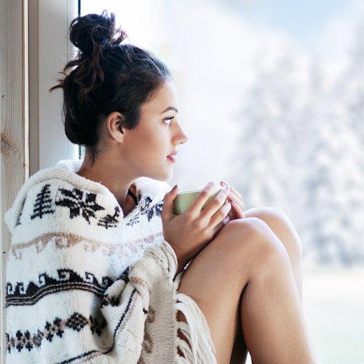 Girl looking out through the window