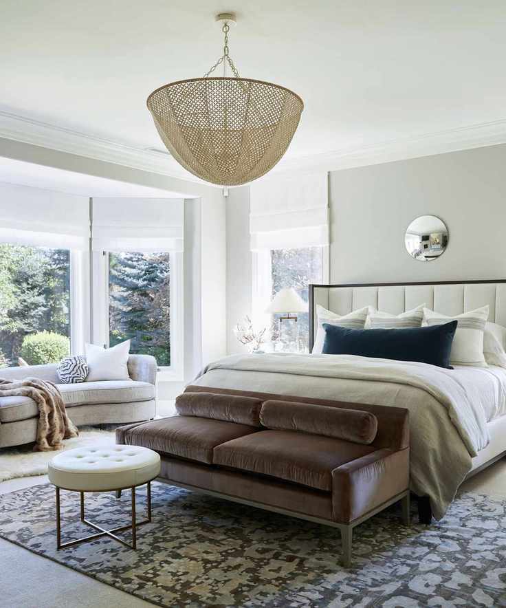 Stylish bedroom with a daybed at the foot of the bed