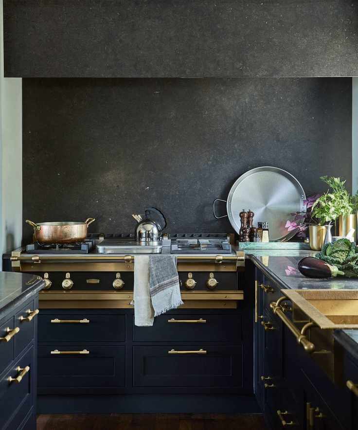 Dark cabinetry with brass details