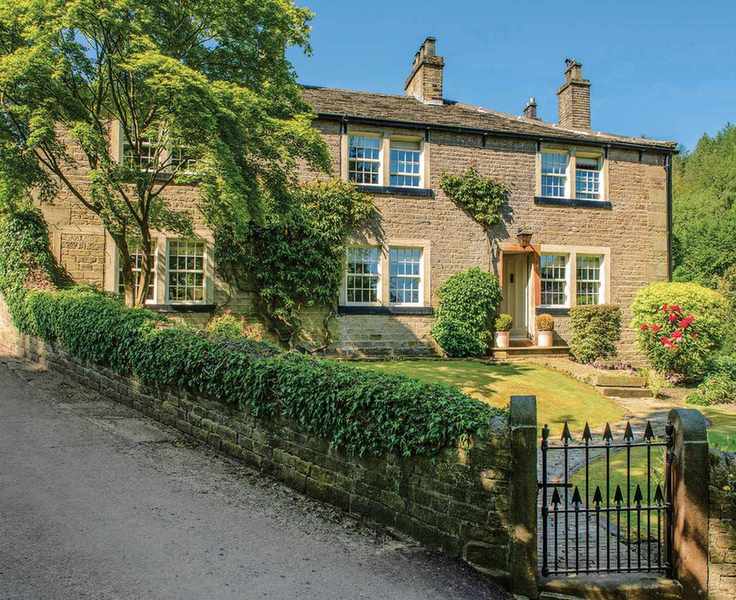 Steel gate illustrated in a stone wall, with a winding path leading to a stone cottage.