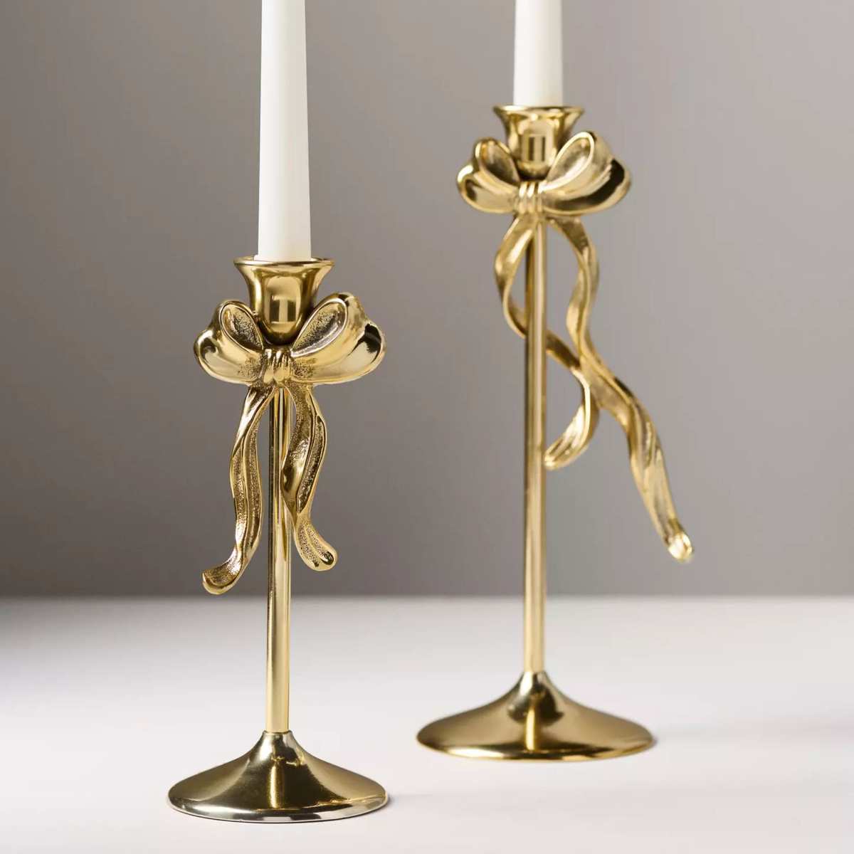 Gold taper candle holder with bowl detail