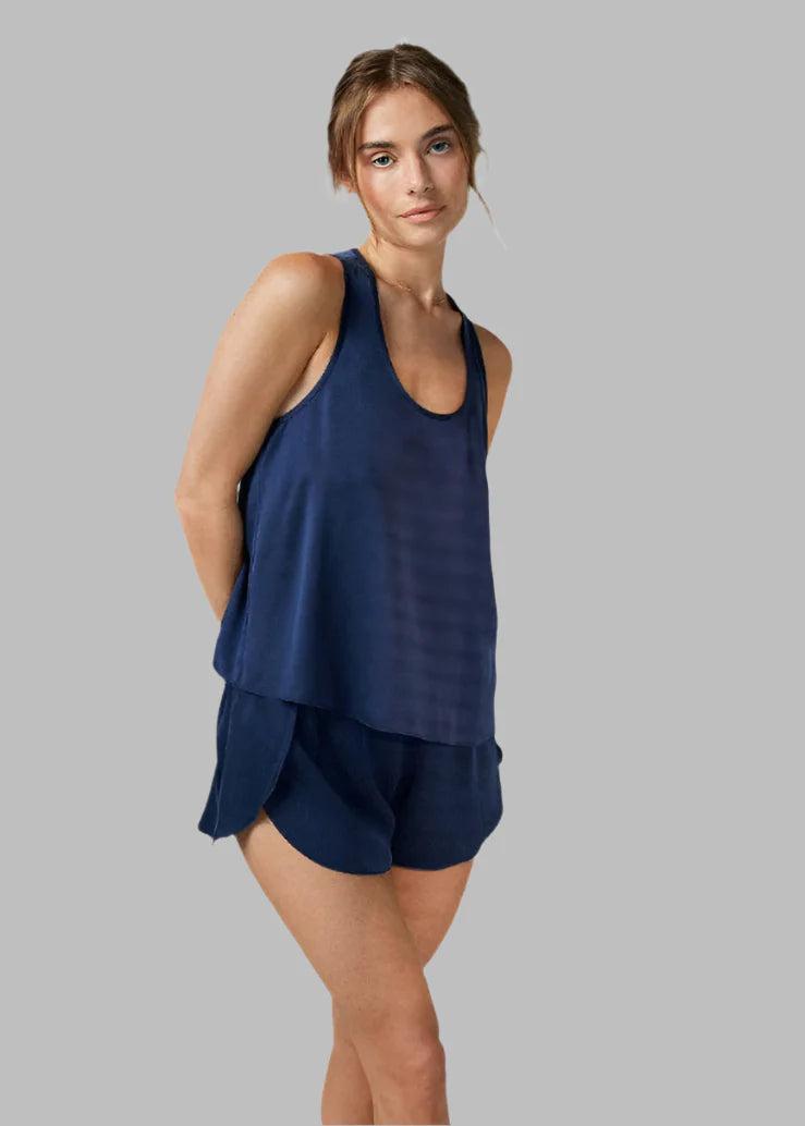 Woman in blue-colored washable silk PJs