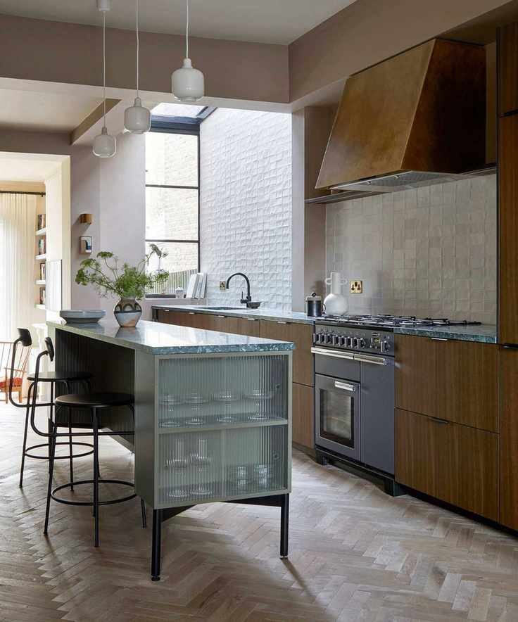 Dark wooden kitchen with slim kitchen island, marble countertop
