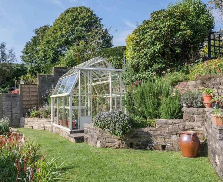 small greenhouse in garden