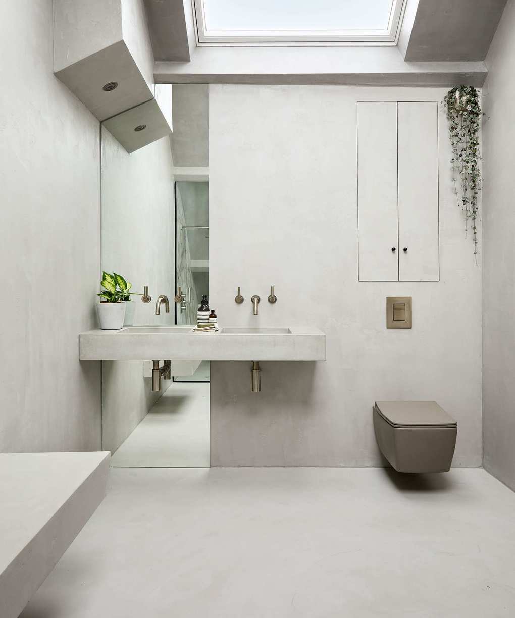 Cloakroom featuring grey concrete walls and flooring