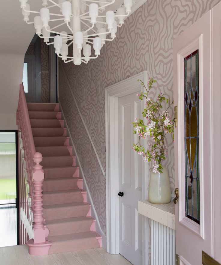 Pink entryway with wiggle pattern wallpaper