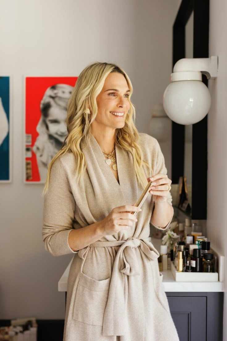 Molly Sims using skincare products.