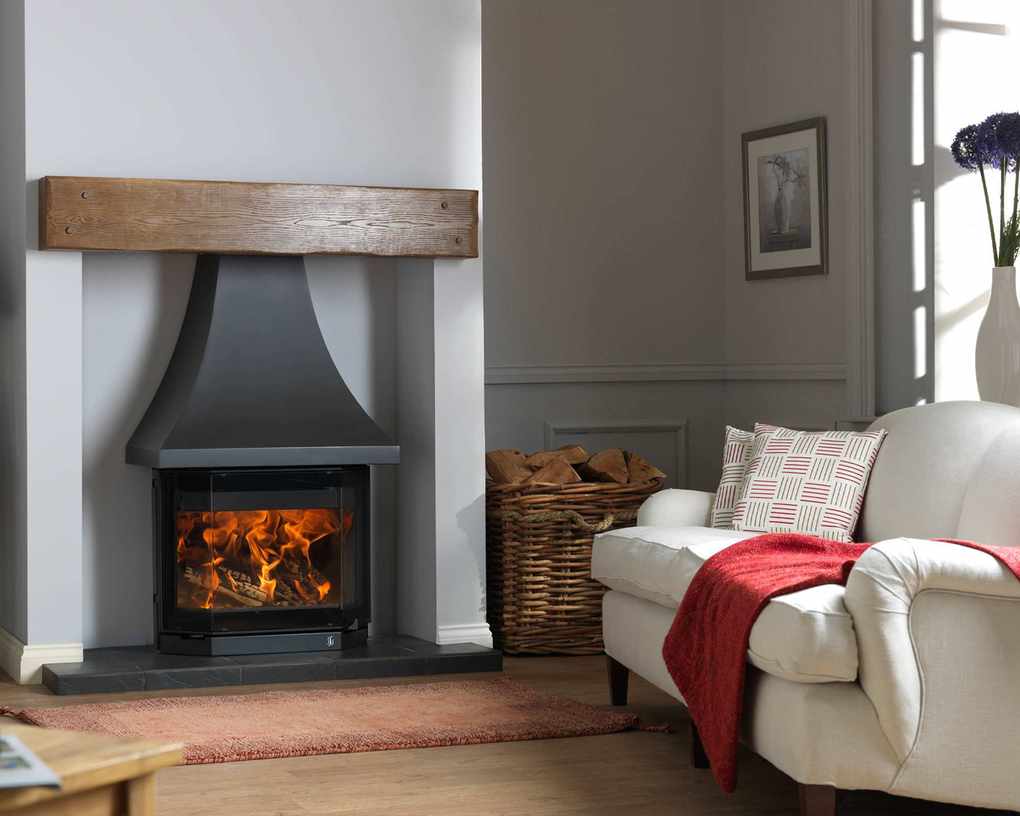Living room with a wood burner featuring a canopy