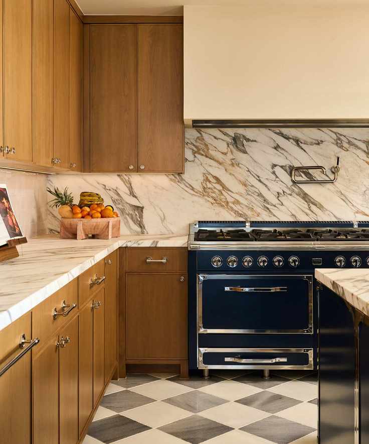 wood kitchen with marble and black range cooker