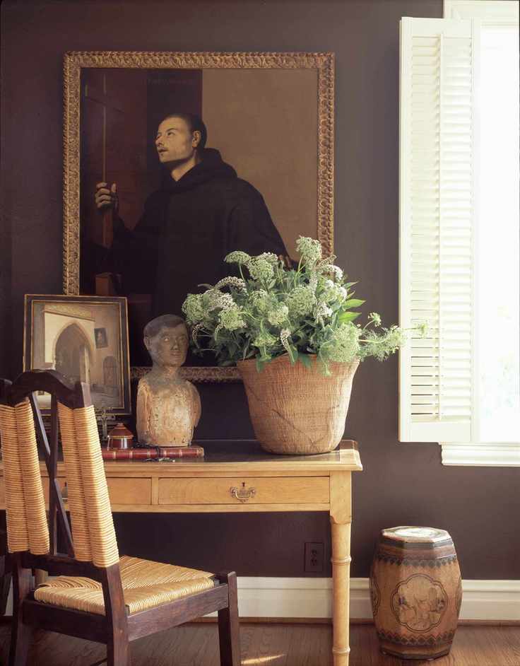 Michelle Nussbaumer designed apartment with portrait and dark paint