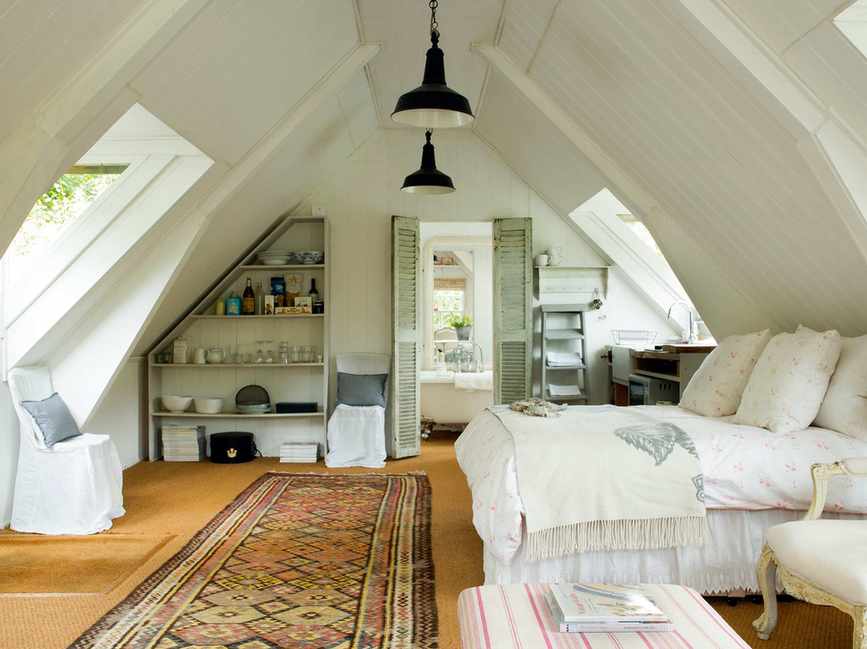 Bright attic bedroom in cottage style