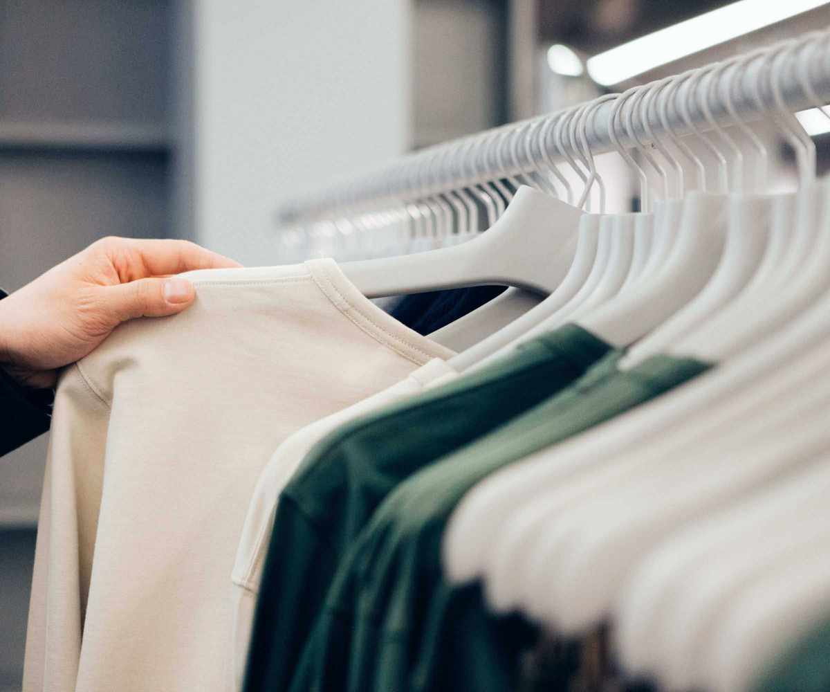 Clothes hanging neatly on a clothing rail