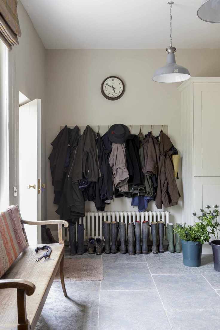 boot room with pegs for coats and radiator