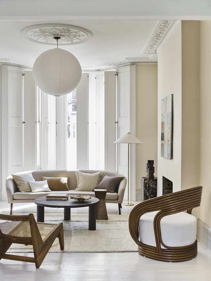 White shutters, wooden chairs, black coffee table