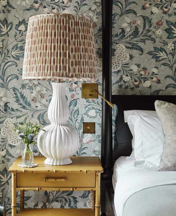 A colorful fabric lampshade on a nightstand