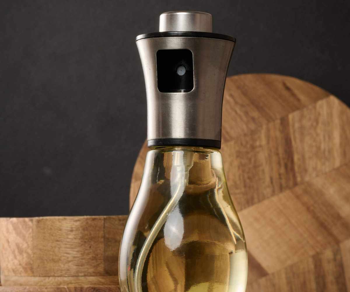 A glass olive oil spray bottle