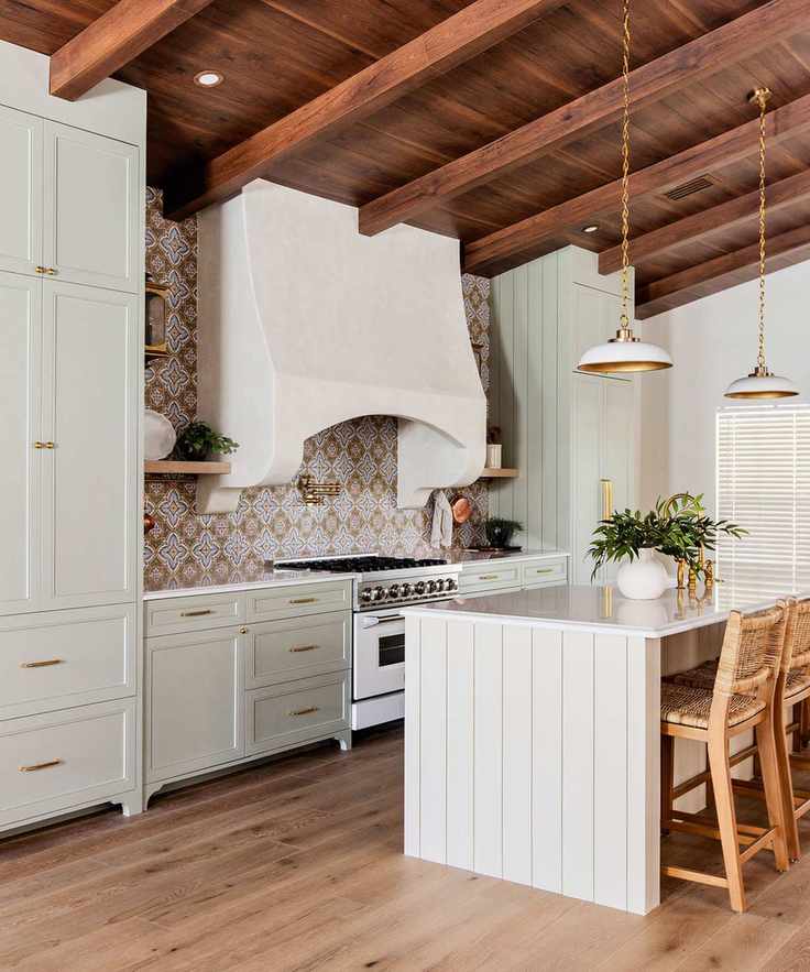 Plaster chimney-style hood in country kitchen