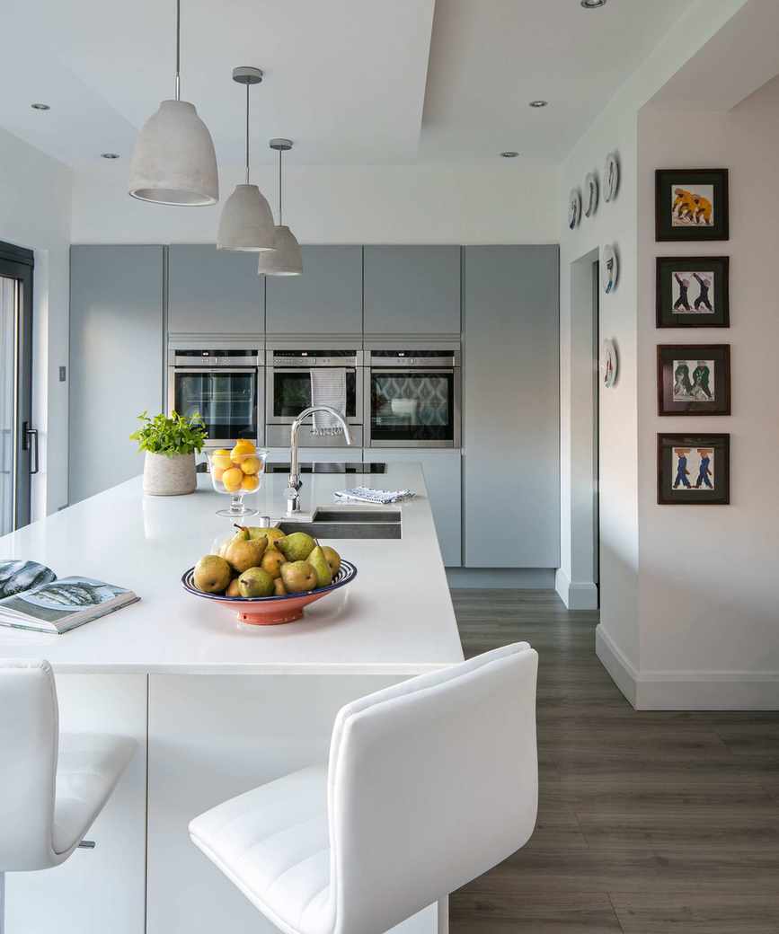 Wood-look laminate in a bright kitchen featuring a breakfast bar.