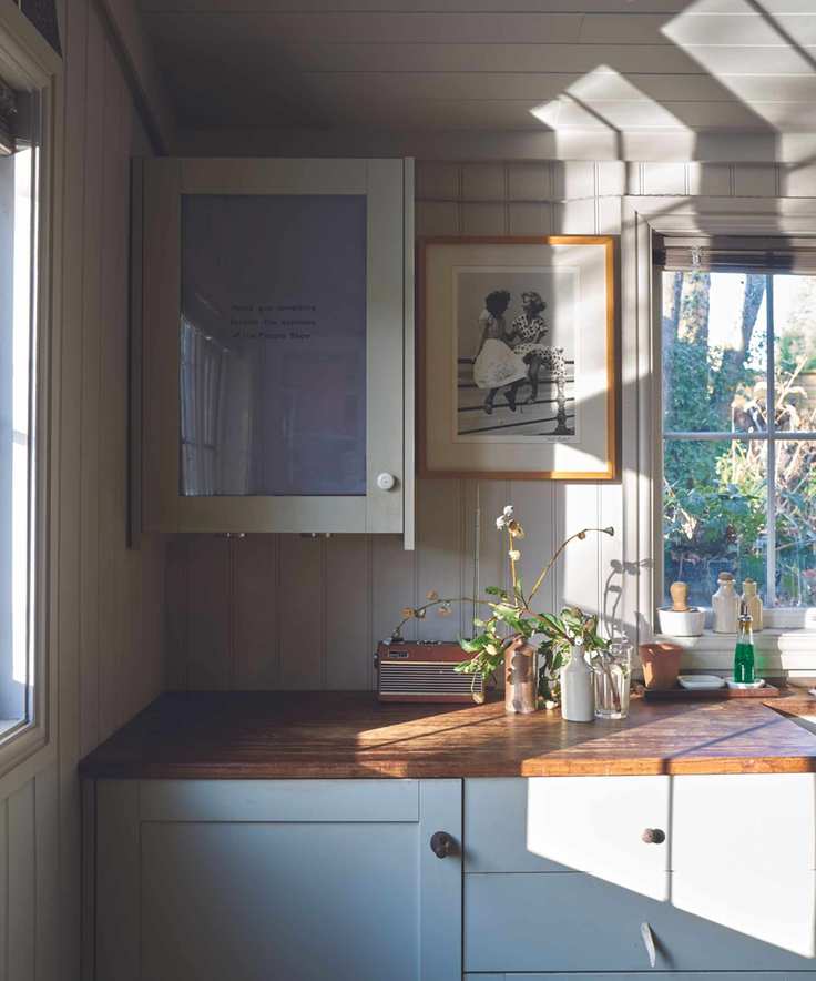 Modern farmhouse kitchen with shaker cabinets painted pale blue