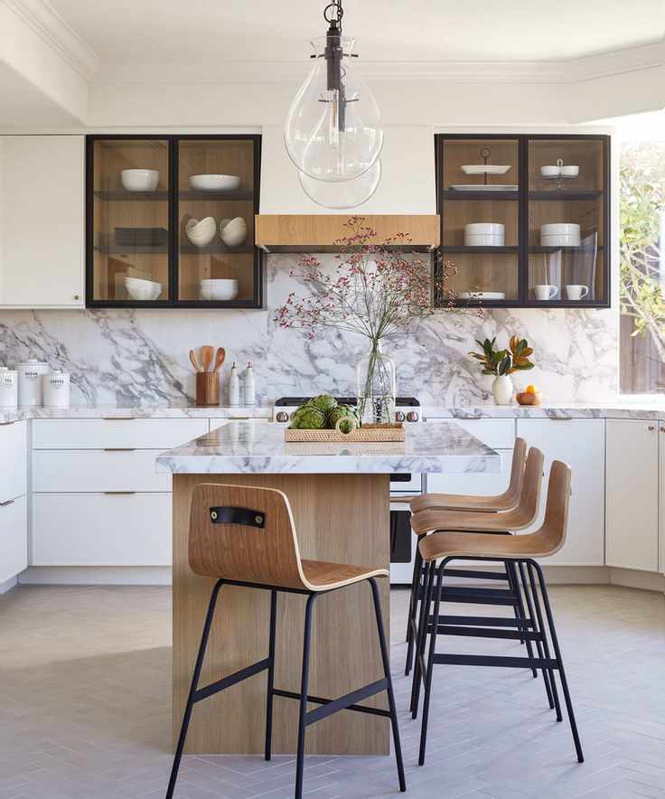 Black and white kitchen with marble island