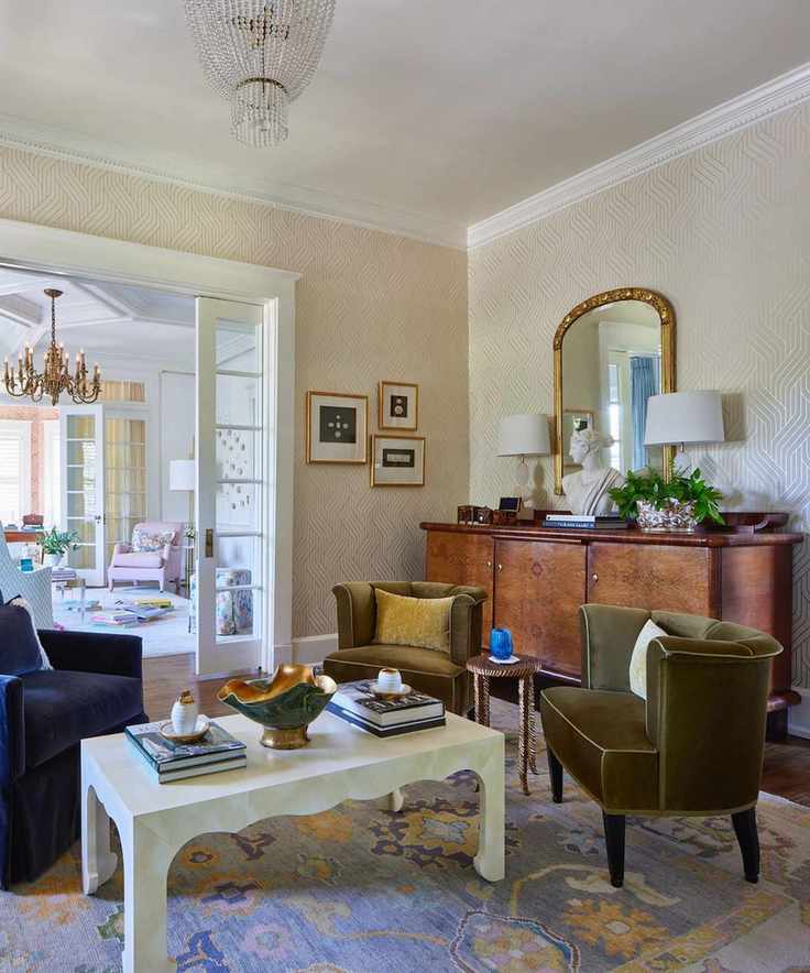 A living room with an antique dresser and seating