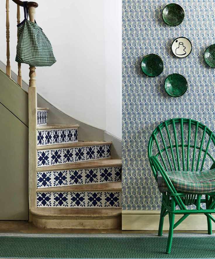 Statement green entryway and tiled staircase