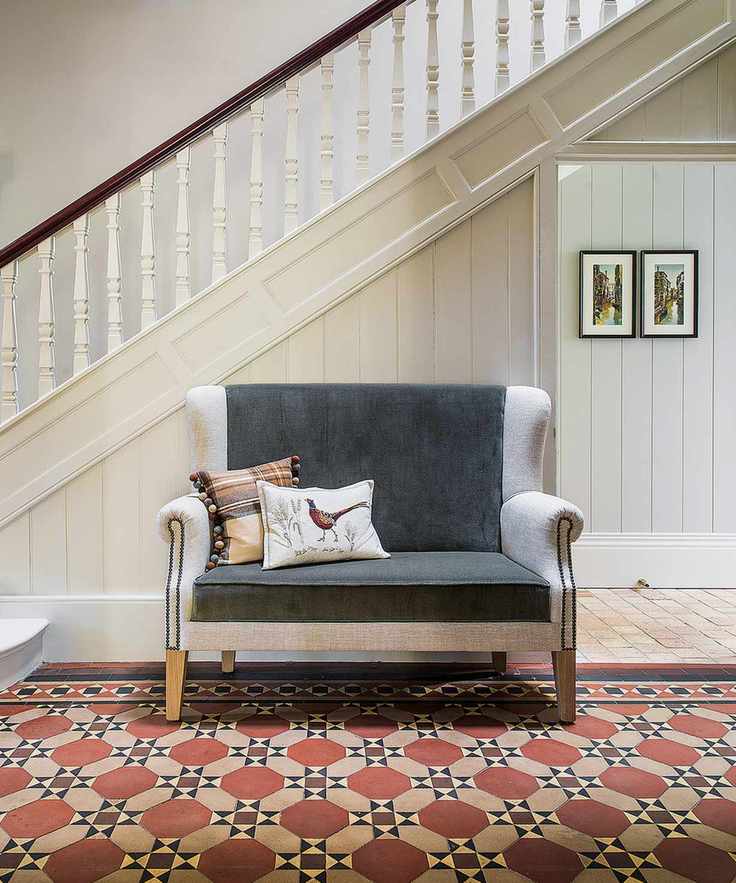 Encaustic tiles in hallway with sofa