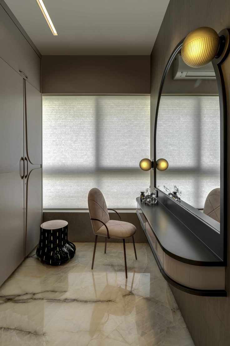 bespoke dressing room with curvy furniture, fitted wardrobes behind