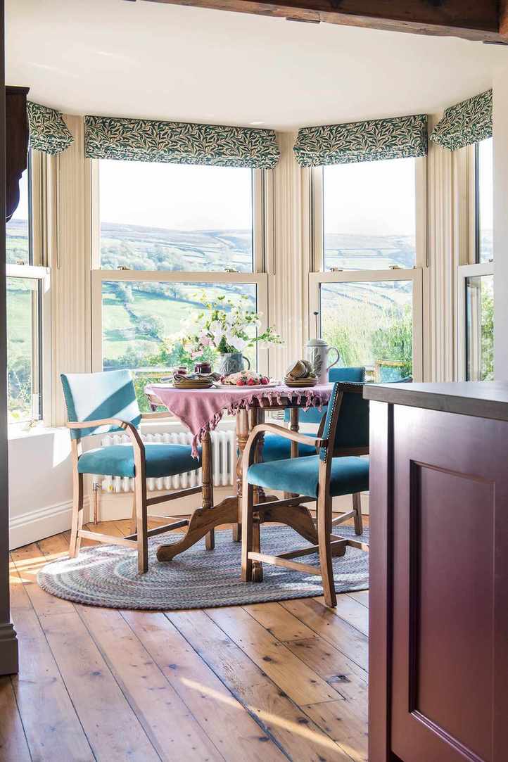 Bay window with dining area and wood floor