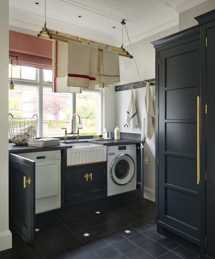 Laundry room with built-in cabinetry hiding appliances for a clean look.