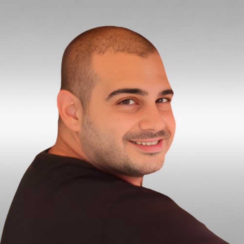 headshot of Gal Cohen an expert in sliding doors with a shaved head