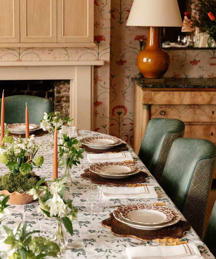 traditional spring table with flowers in bud vases