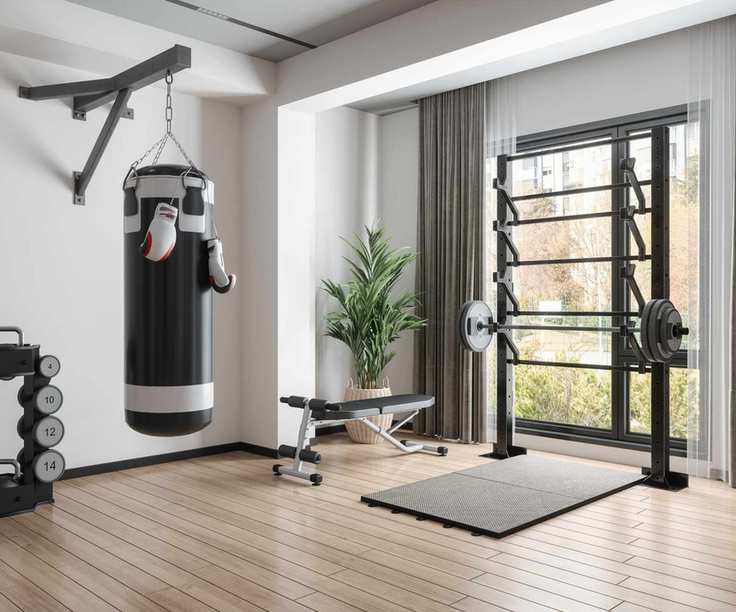 A home gym in a white room with black gym equipment