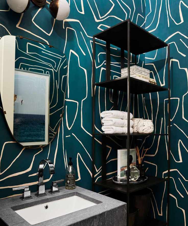 Bathroom with botanical wallpaper and decorative shelving