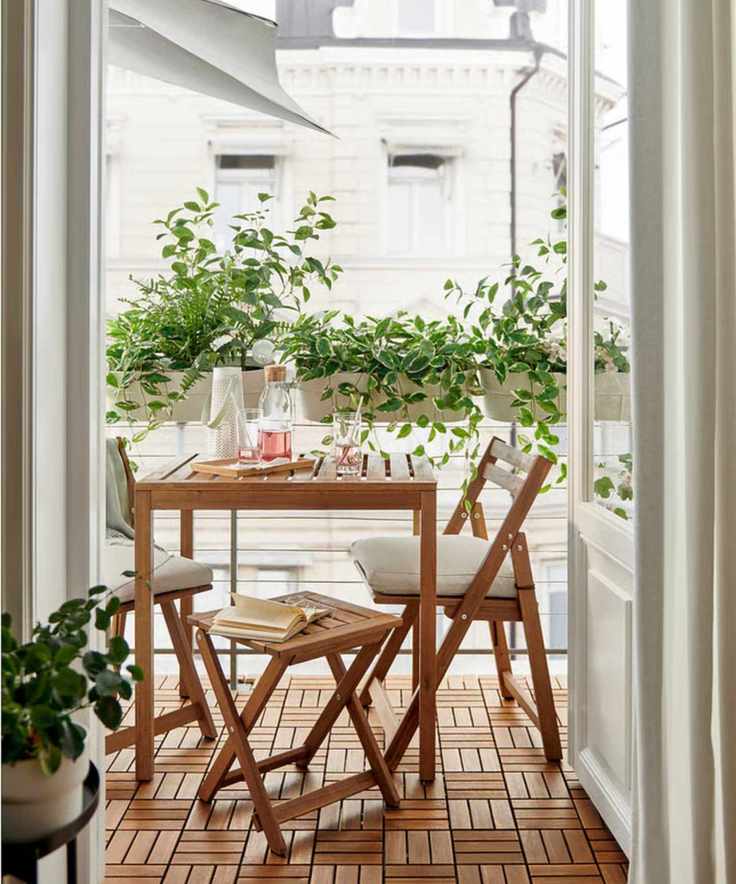 a bistro table on a small porch