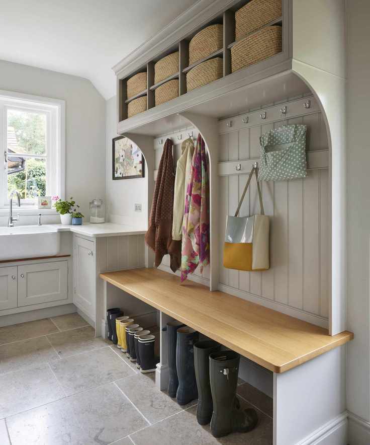 Laundry room styled as a boot room with dedicated space for footwear and outerwear.