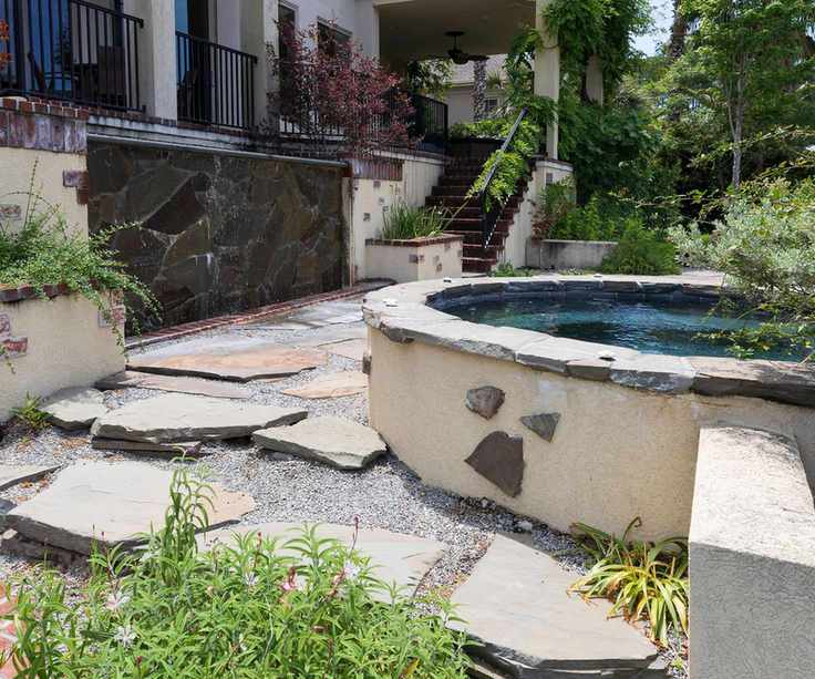 hot tub clad with stone