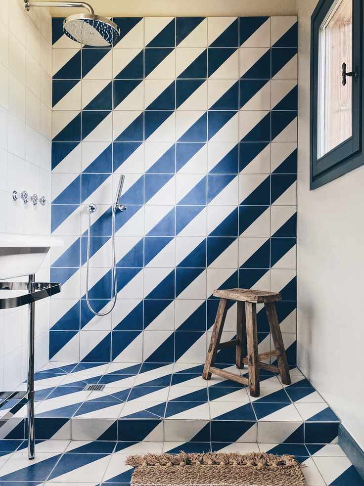 blue & white shower tiles in walk in shower