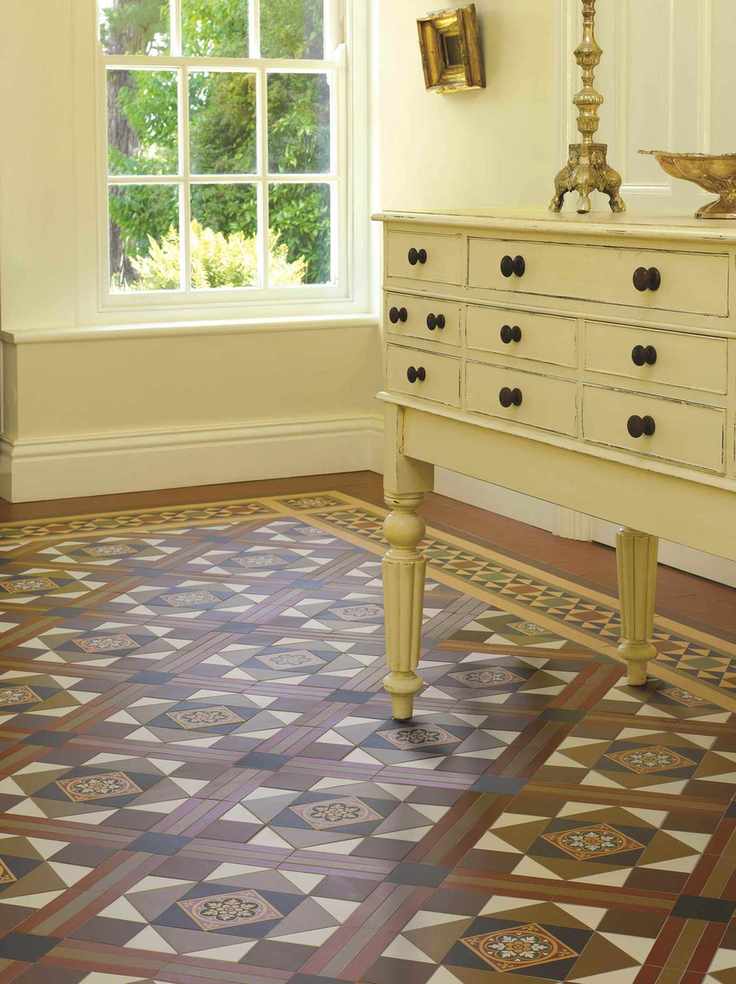 Room with patterned tile floor and console
