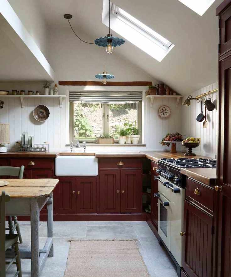 Large kitchen with deep red cabinets