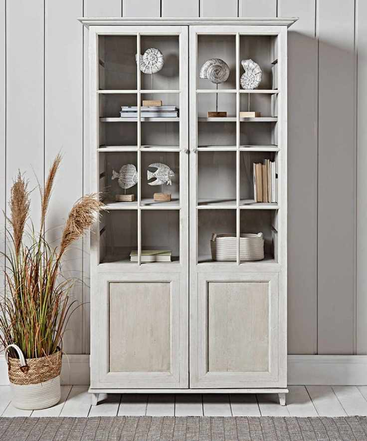 Neutral glass-fronted dresser with nautical accessories