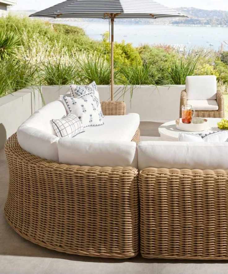 Outdoor living room with woven seating and soft planting