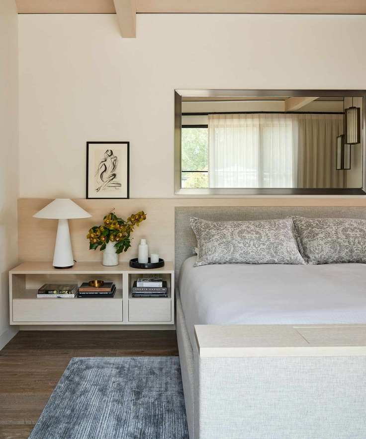 neutral bedroom with a hidden tv in the base of the bed
