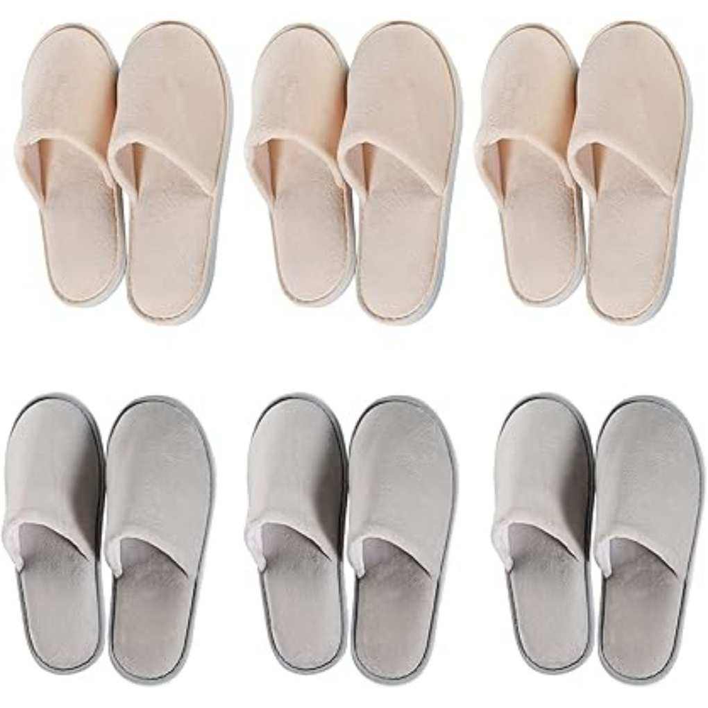 Three pairs of pink slippers above three pairs of grey slippers