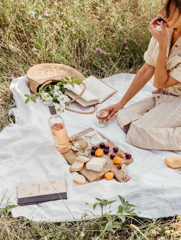 aesthetic picnic set up in wildflower field_summer solstice menu ideas