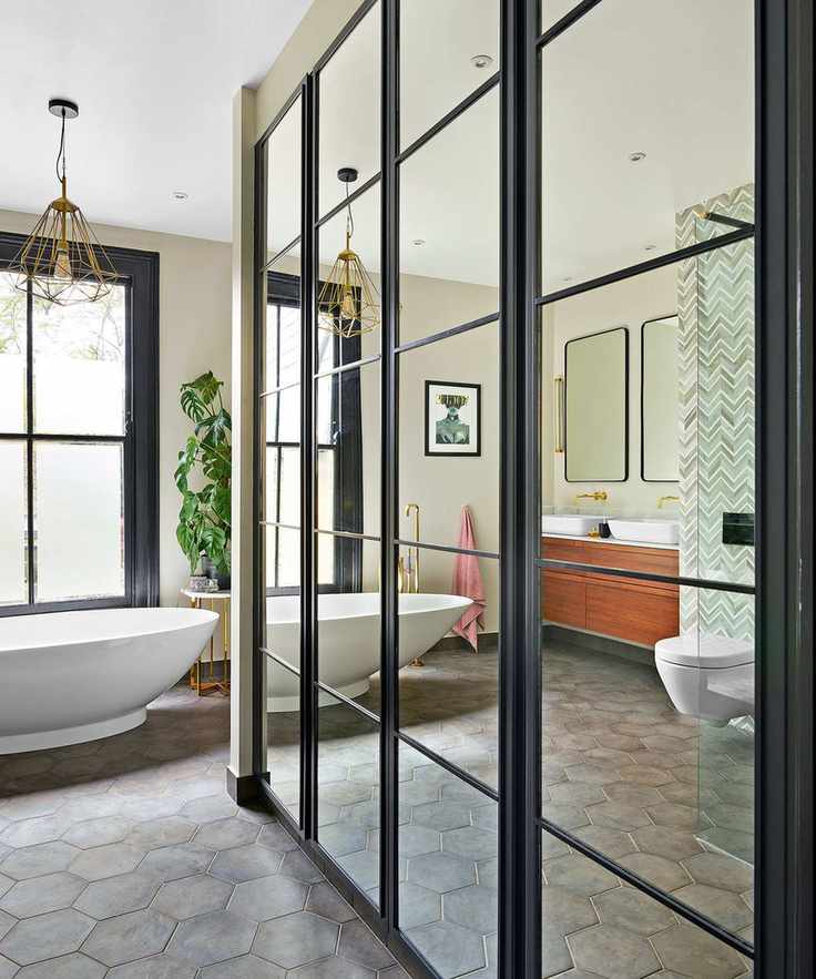 Guest bathroom featuring a large mirror